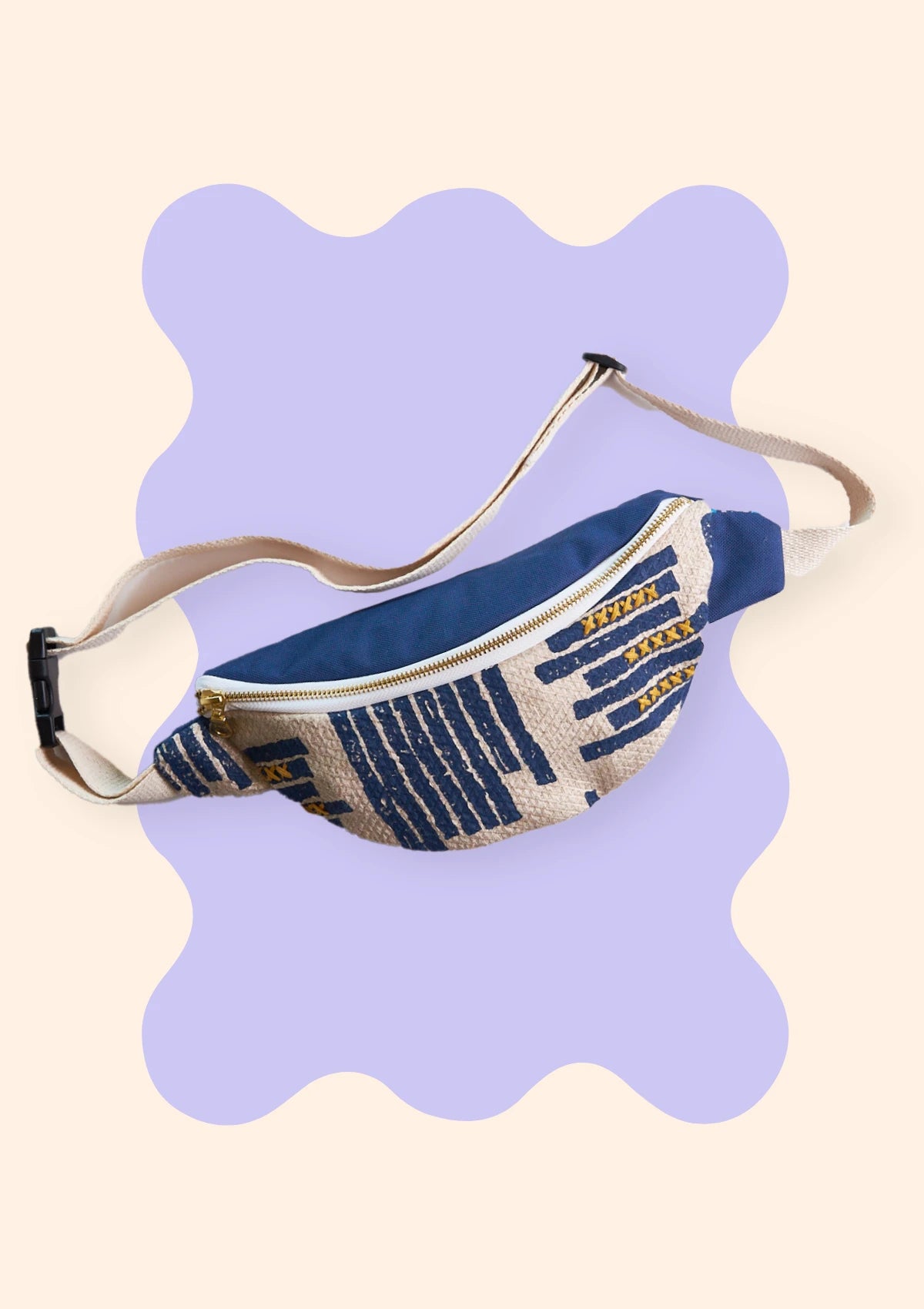 Fanny Pack on a purple scalloped background
