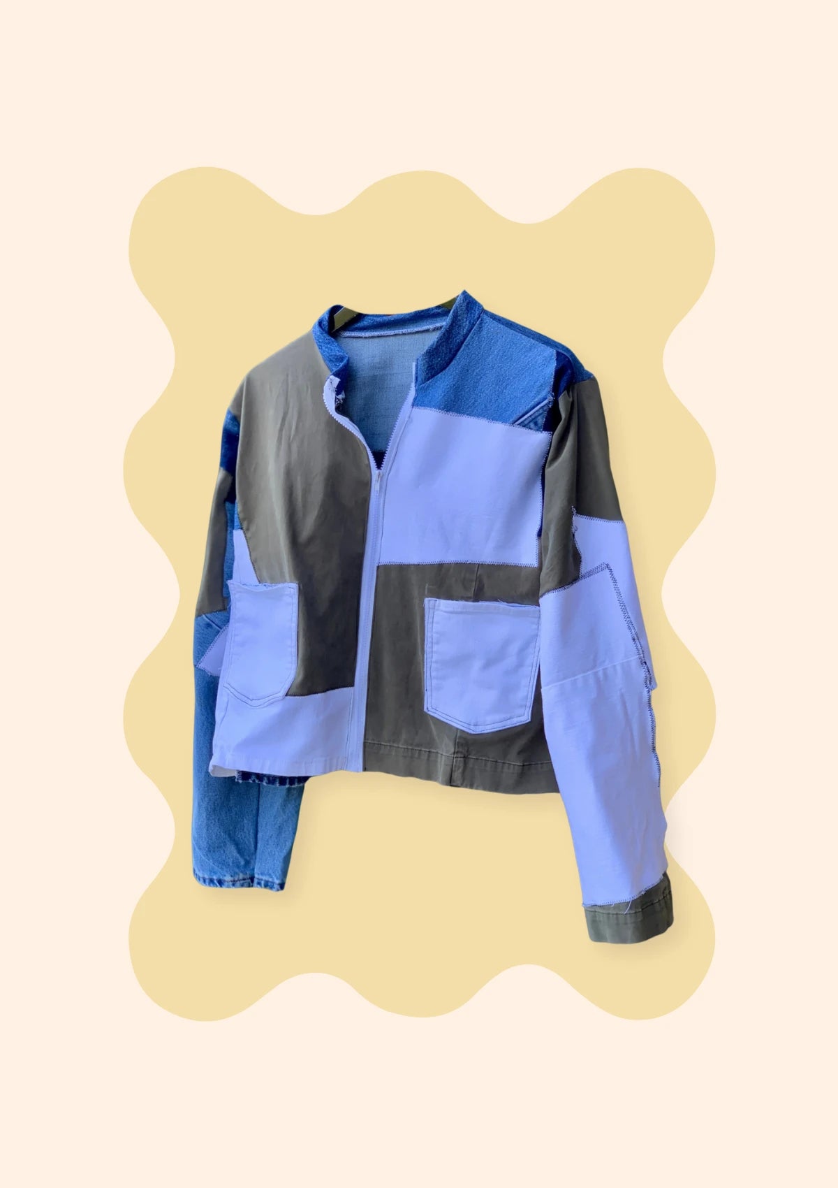 Denim patchwork jacket on a soft yellow scalloped backdrop