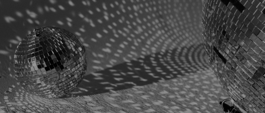 Discoball casting shadows on a textured wall