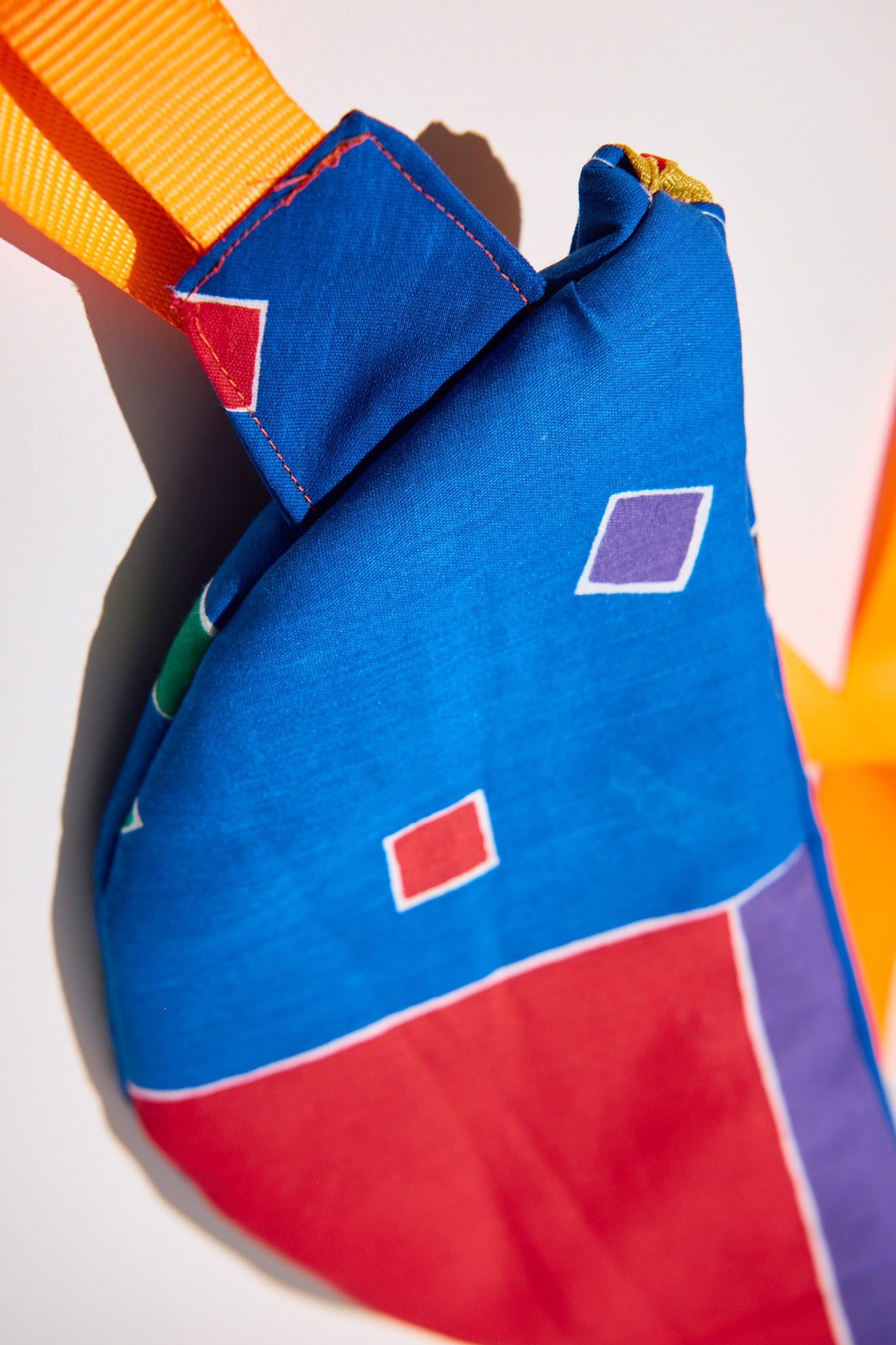 details of cross body bag with geometric pattern upcycled from comforter 