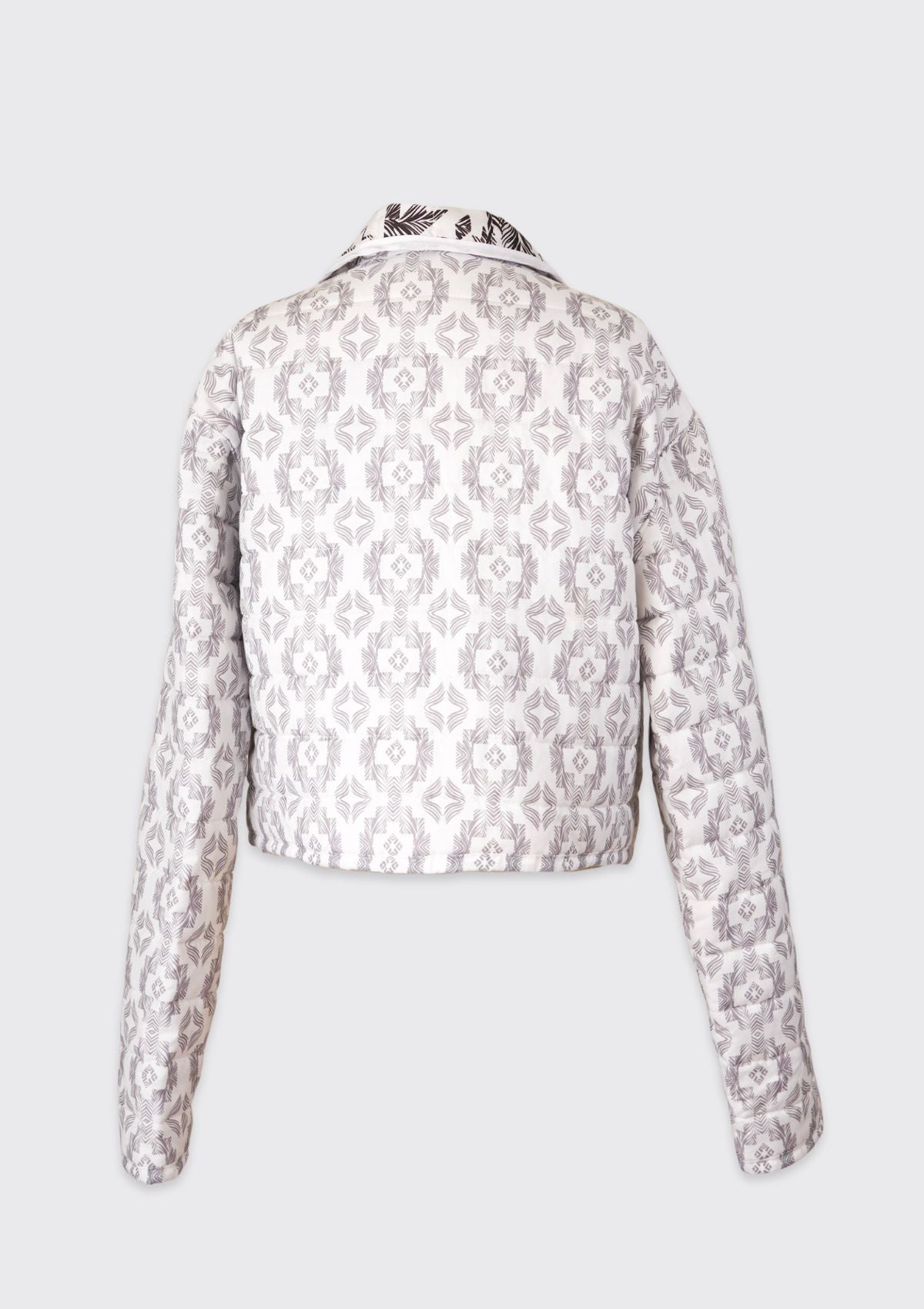 Upcycled from a comforter black and white patterned jacket on a light gray background