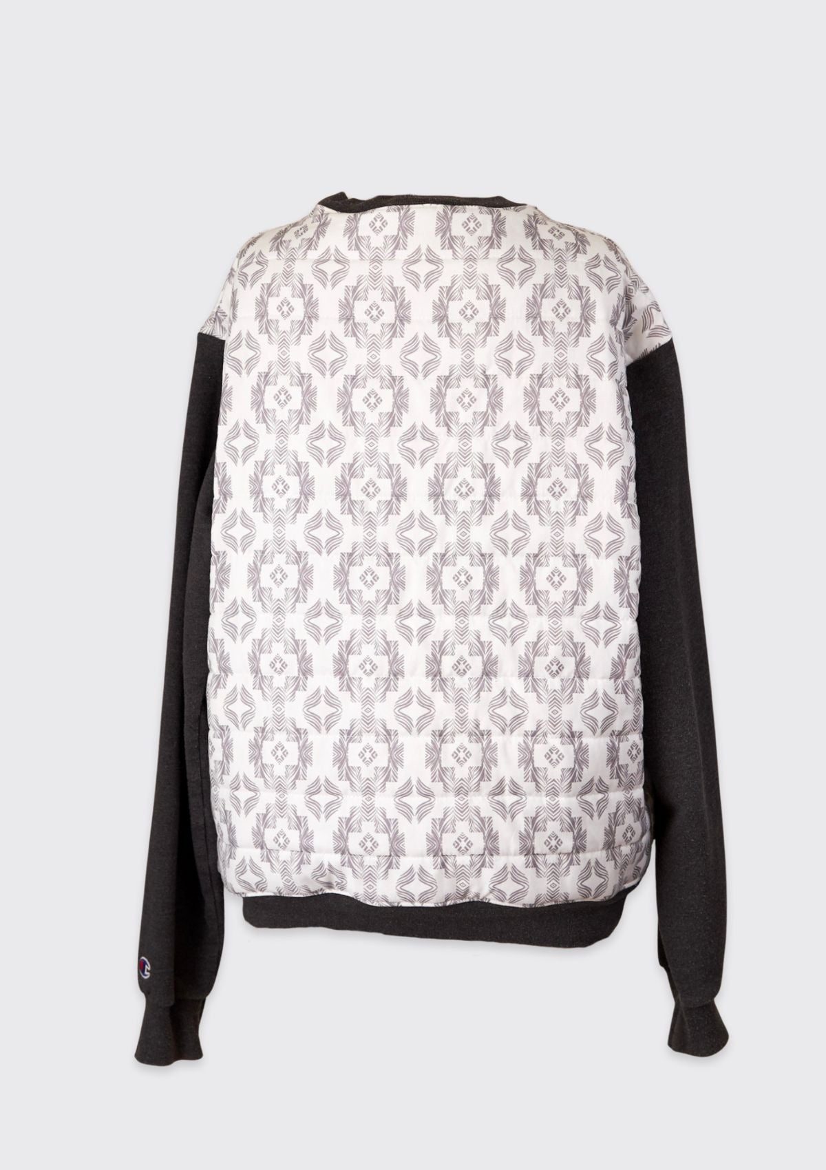 Sweatshirt upcycled from comforter with a black and white pattern on a light gray background