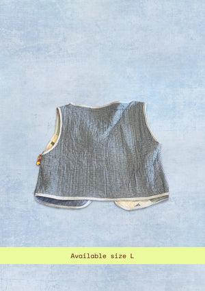 Textured sleeveless top upcycled from a quilt on a light blue background with 'Available size L' text.