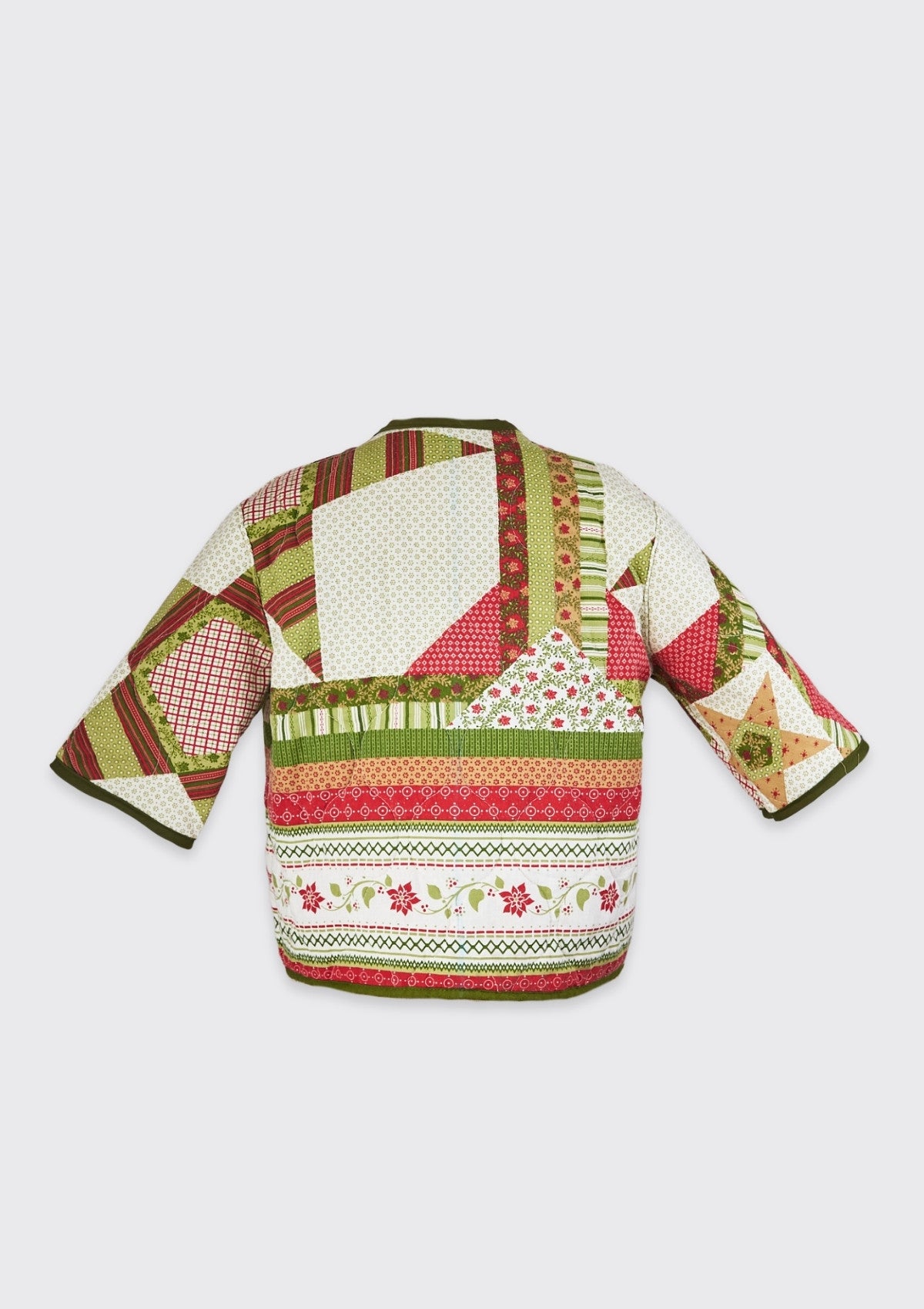 Colorful festive quilted jacket  upcycled from comforter with geometric and floral holiday patterns on a white background