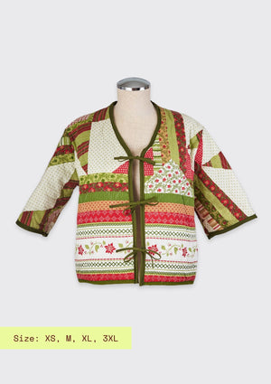 Colorful patterned festive holiday jacket  upcycled from comforter on a mannequin with size information displayed.