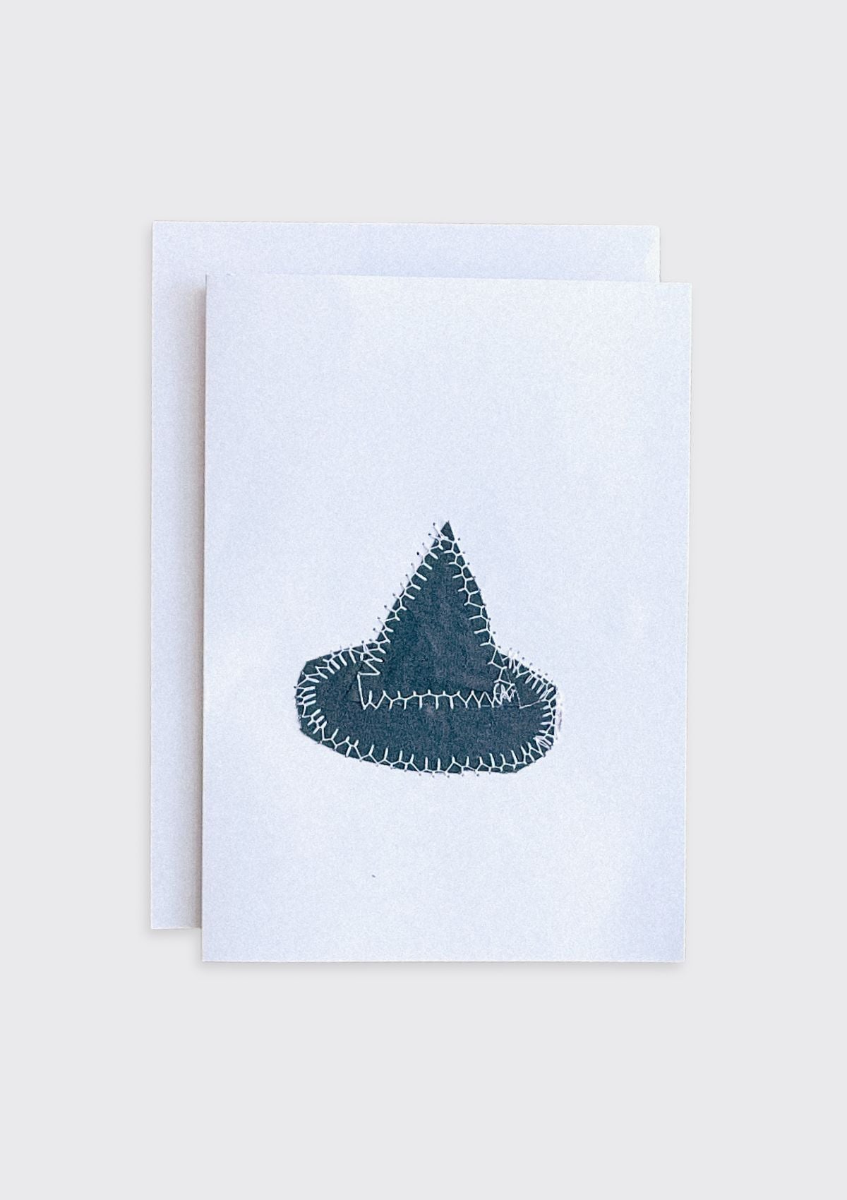 Greeting card with a black witch hat fabric design upcycled from quilt on a white background