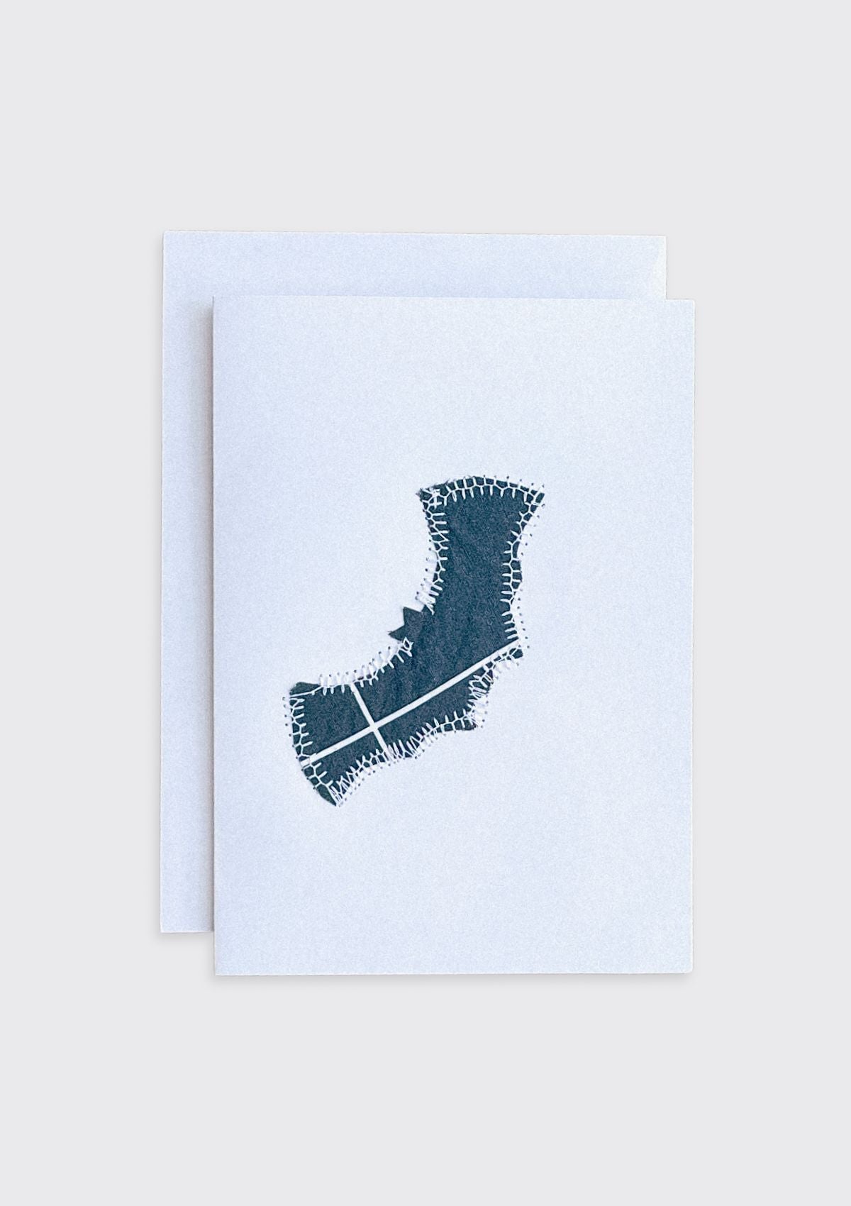 Greeting card with a sewn bat design upcycled from duvet cover on a light cream background