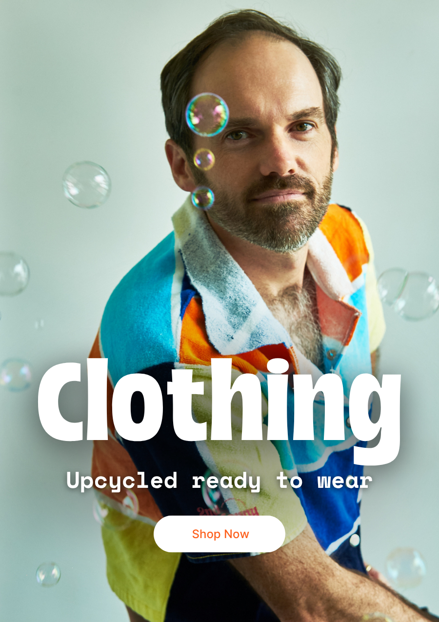 Man wearing colorful upcycled clothing with text overlay on a light background