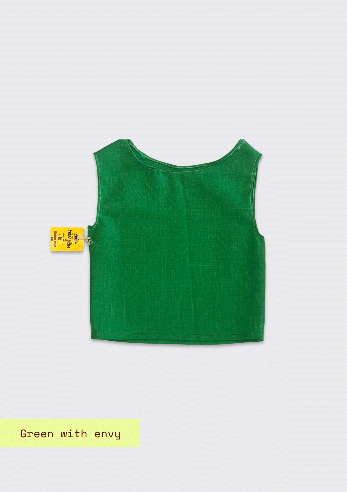 Green sleeveless top upcycled from a tablecloth on a light gray background with 'Green with Envy' text.