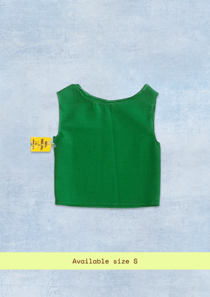 Green sleeveless top upcycled from a tablecloth on a light blue background with size label.