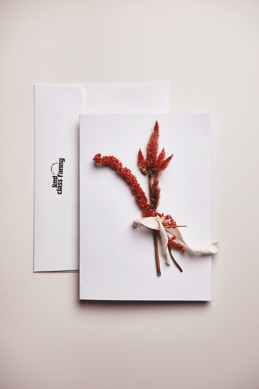 Greeting card with dried flowers on a white background