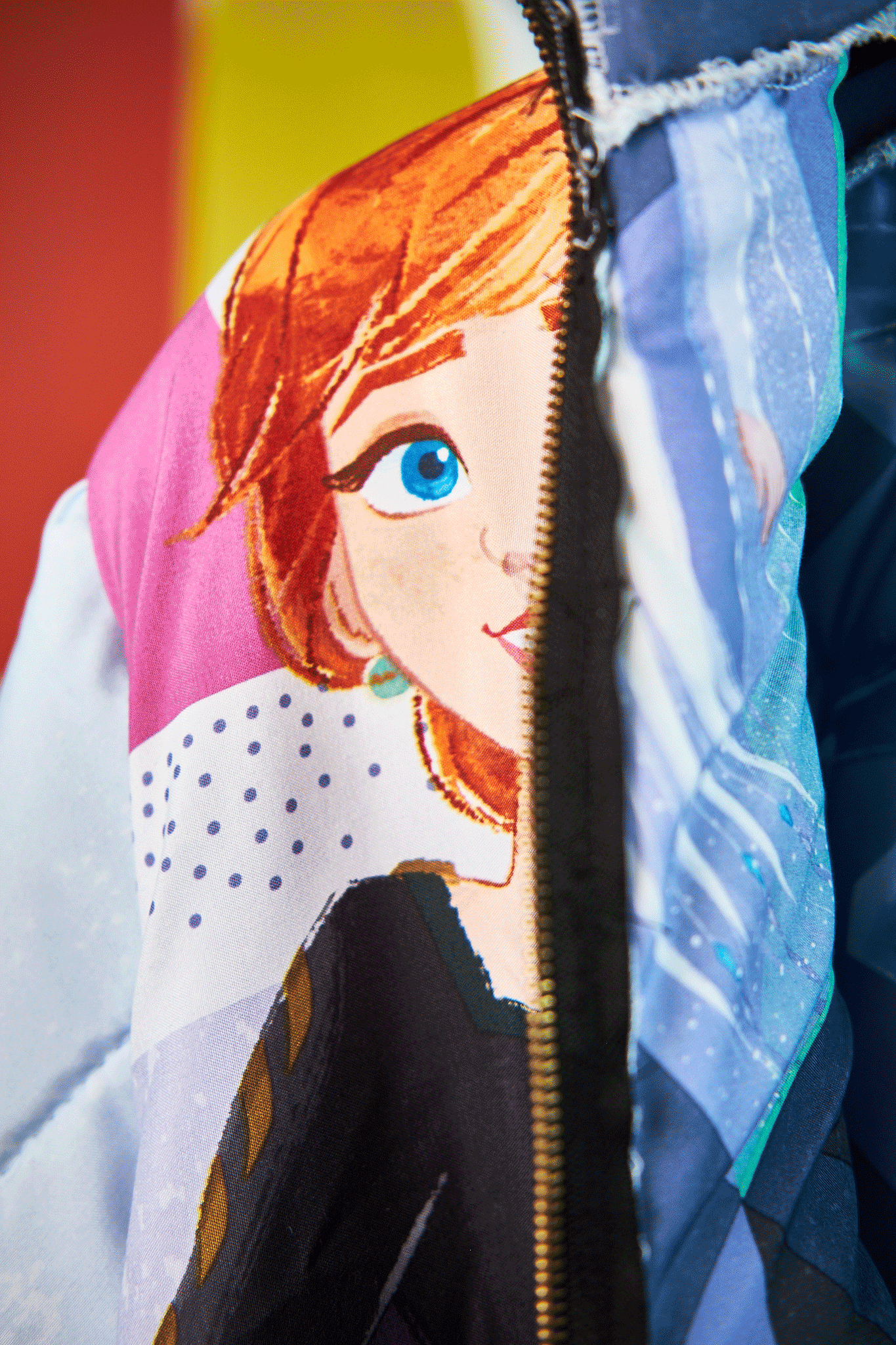 Close-up of Anna from Frozen theme jacket with a character design from upycled Frozen sleeping bag