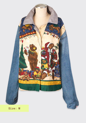 Colorful jacket with holiday bear design upcycled from vintage fabric and denim jeans as sleeves against a light gray background