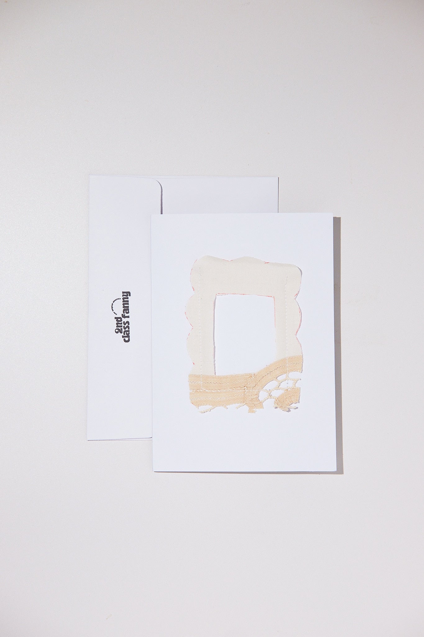 White card with envelope featuring an opening for your own Polaroid with a lace frame from upcycled lace curtains.