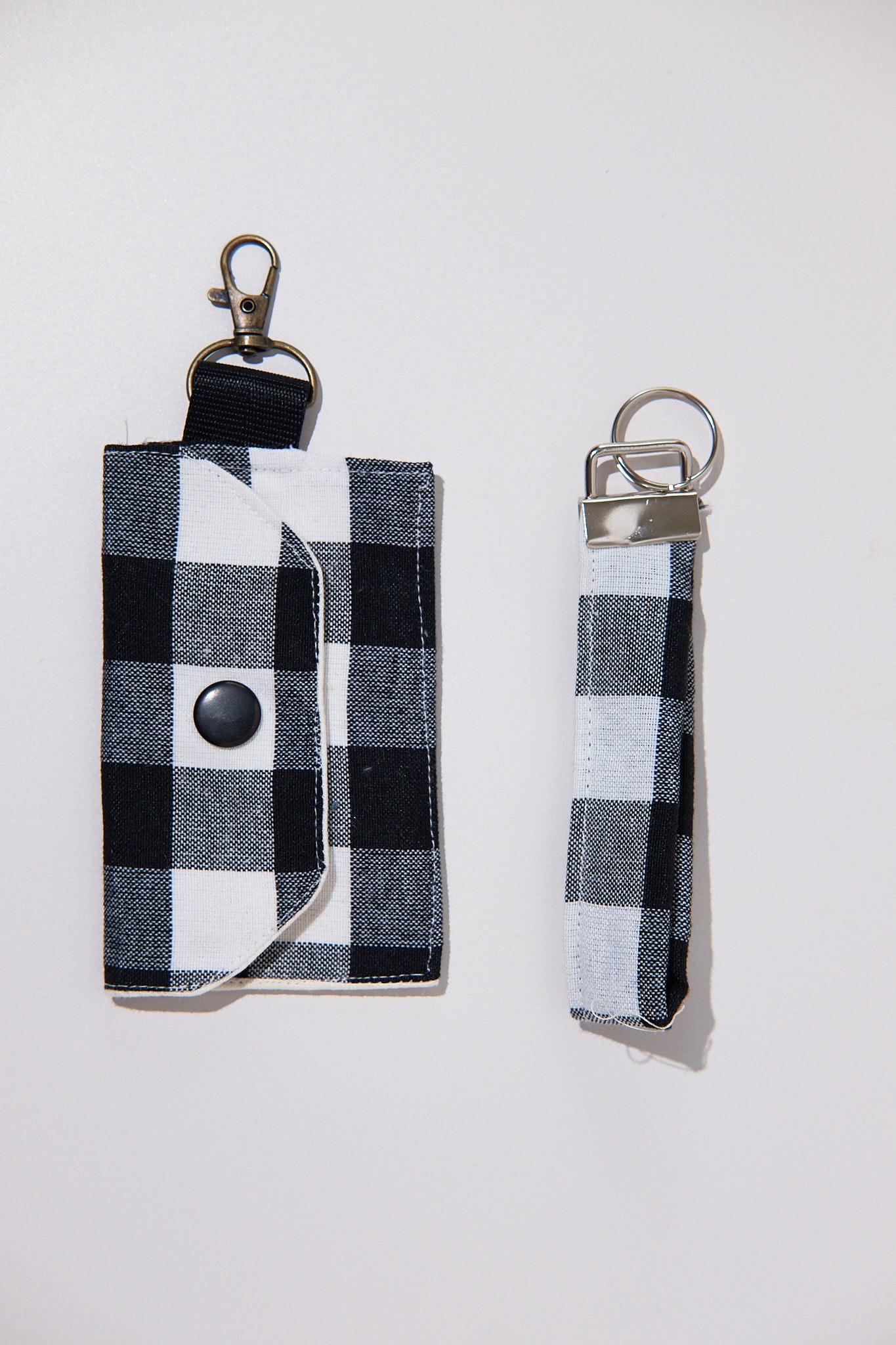 Black and white checkered key chain and pouch upcycled from curtains on a white background