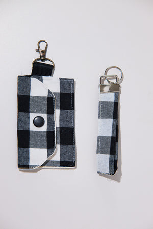 Black and white checkered key chain and pouch upcycled from curtains on a white background