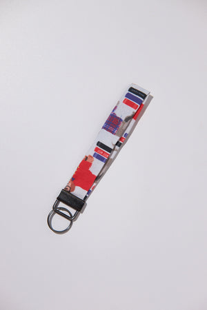 Keychain with colorful pattern upcycled from a bedsheet on a white background