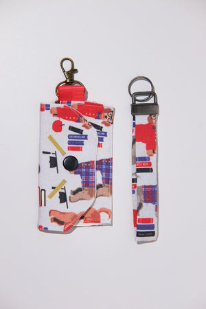 Keychain with ID case with a colorful design of dogs wearing suits upcycled from a bedsheet on a white background