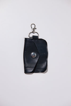Black key case upcycled from inner tube on a white background