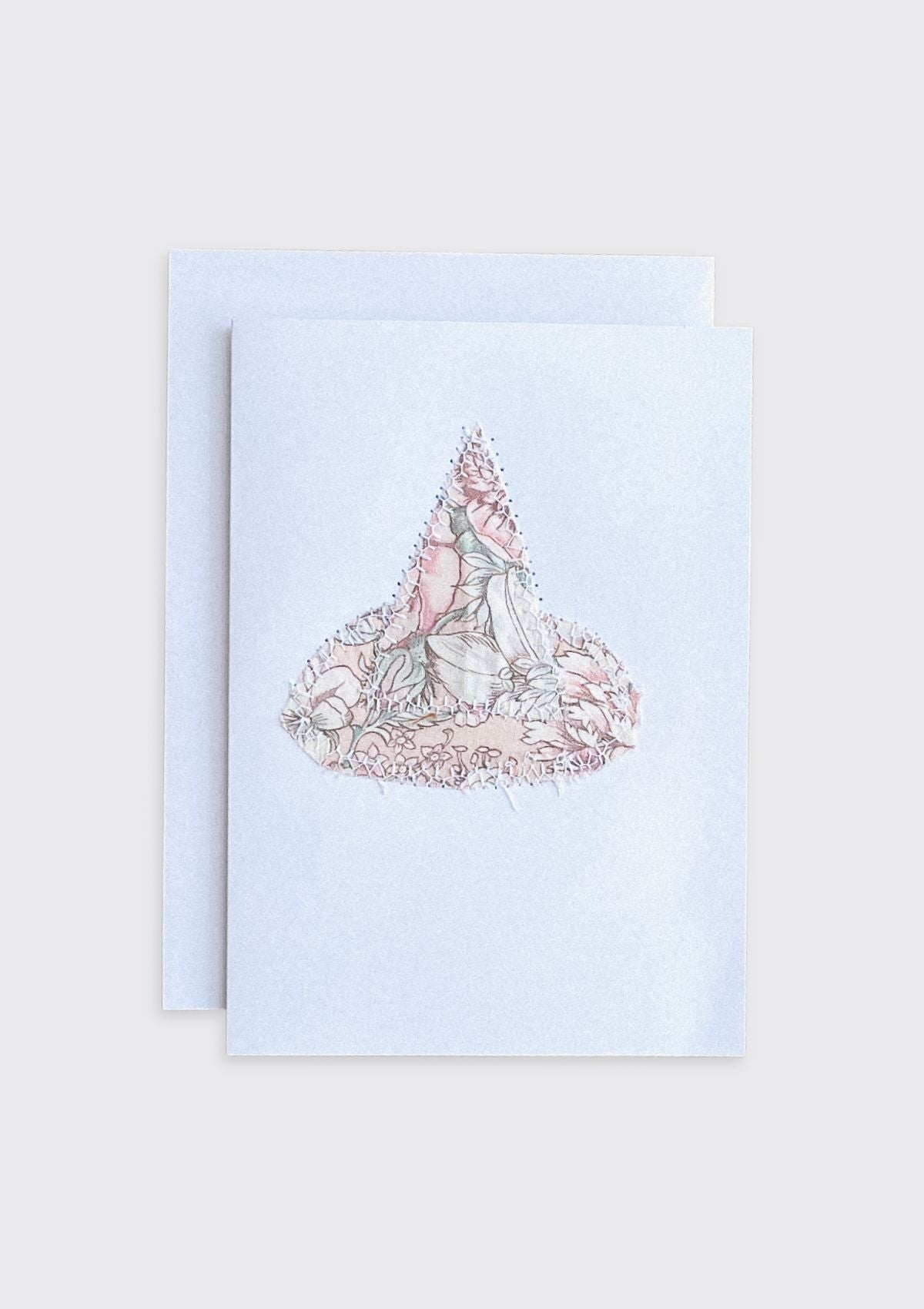 Greeting card with a floral witch hat design upcycled from quilt on a light cream background