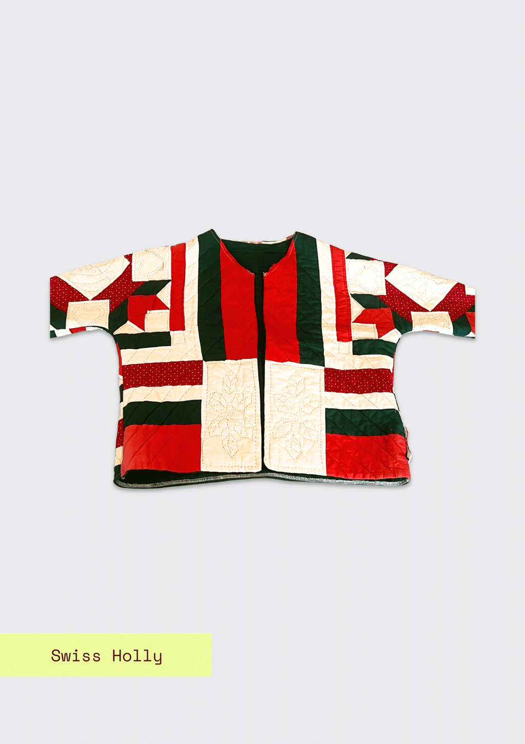 Red and green patchwork jacket with 'Swiss Holly' label on a light gray background