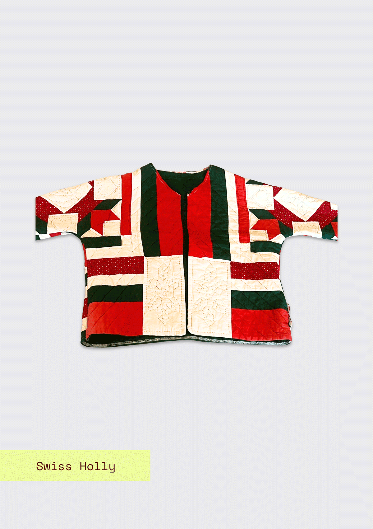 Red and green patchwork jacket with 'Swiss Holly' label on a light gray background