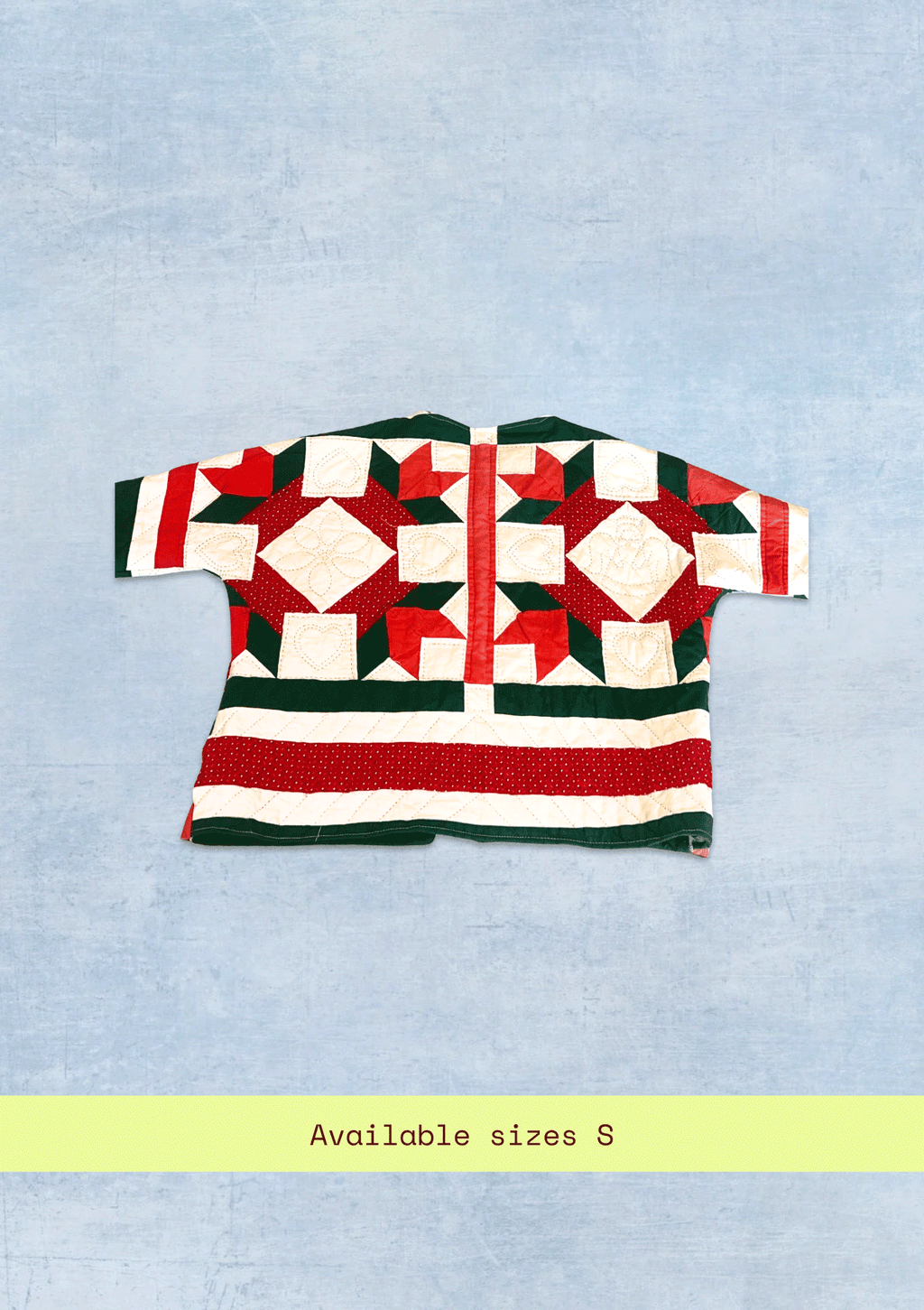Red and green holiday quilted pattern on a light blue background with text indicating size S.