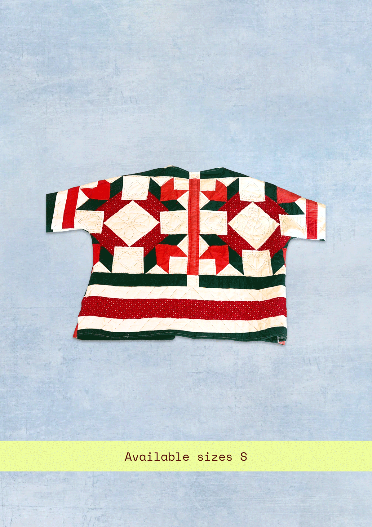 Red and green holiday quilted pattern on a light blue background with text indicating size S.