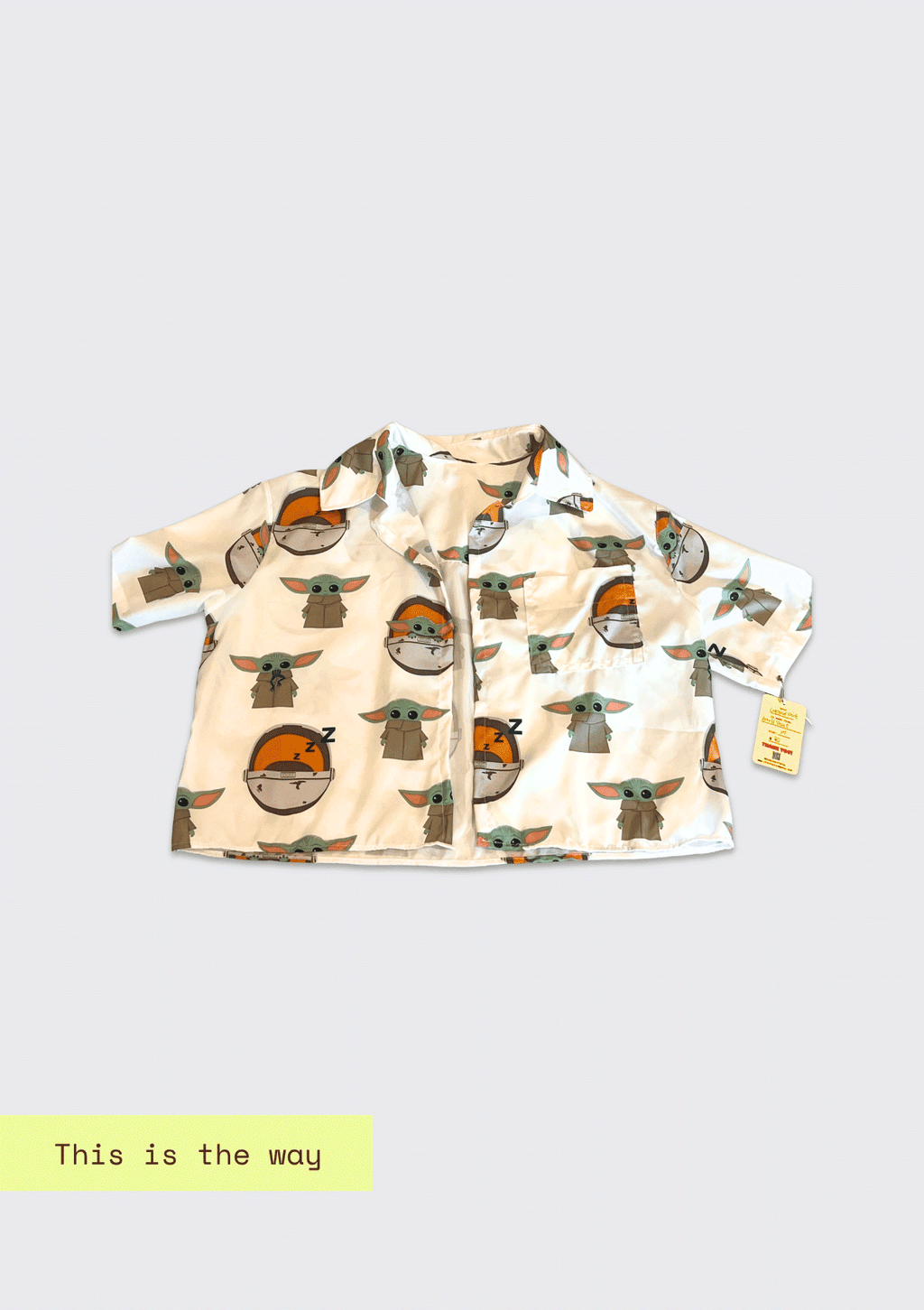 Cropped jacket with character pattern from Mandalorian upcycled from bed sheets on a light gray background