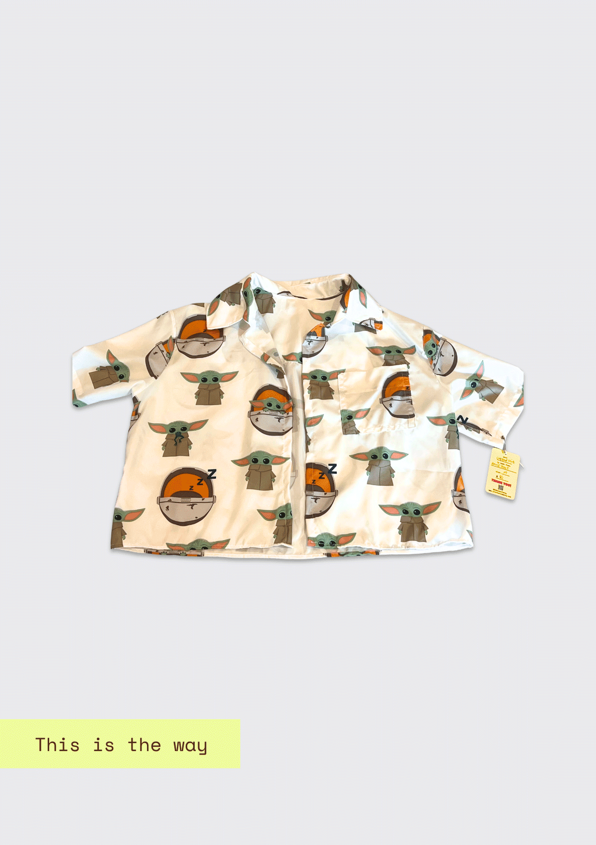 Cropped jacket with character pattern from Mandalorian upcycled from bed sheets on a light gray background