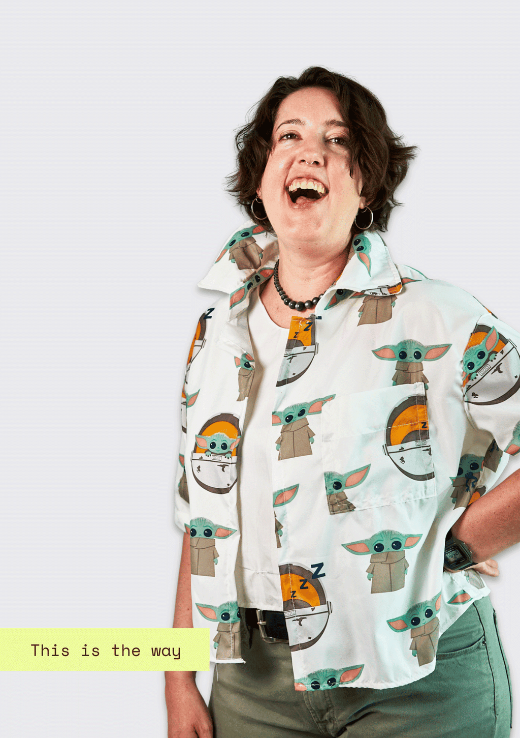 Person wearing an upcycled shirt with 'The Child' pattern and text 'This is the way' on a white background
