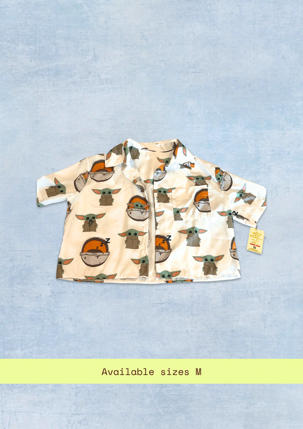 Cropped jacket with character pattern from Mandalorian upcycled from bed sheets on a light blue background