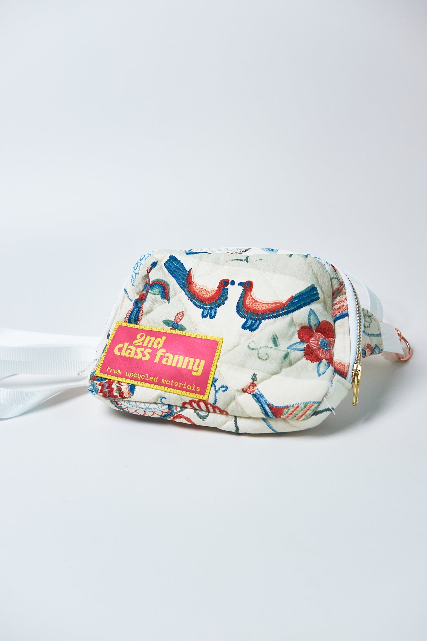 Fanny pack with colorful design and '2nd Class Fanny' label on a white background