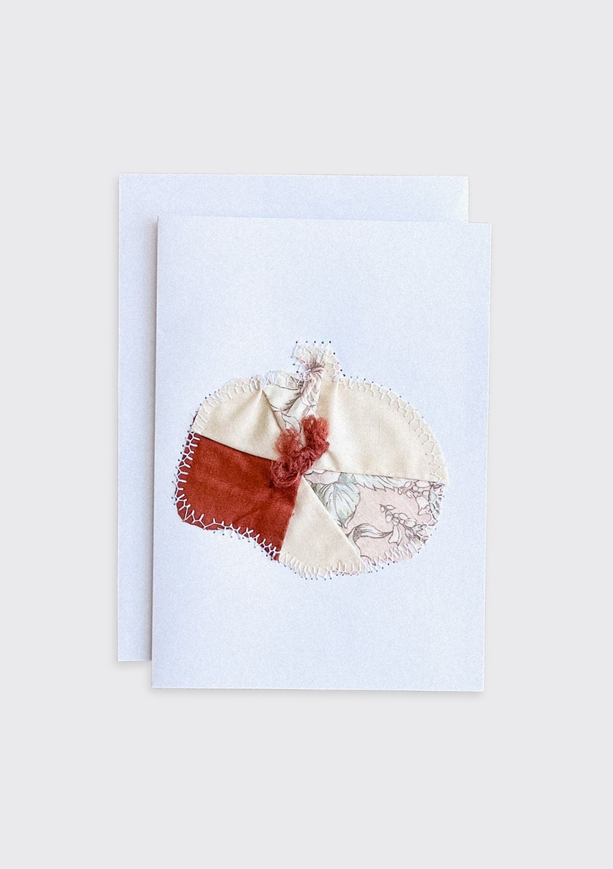 Decorative fabric pumpkin upcycled from quilt greeting card with floral details