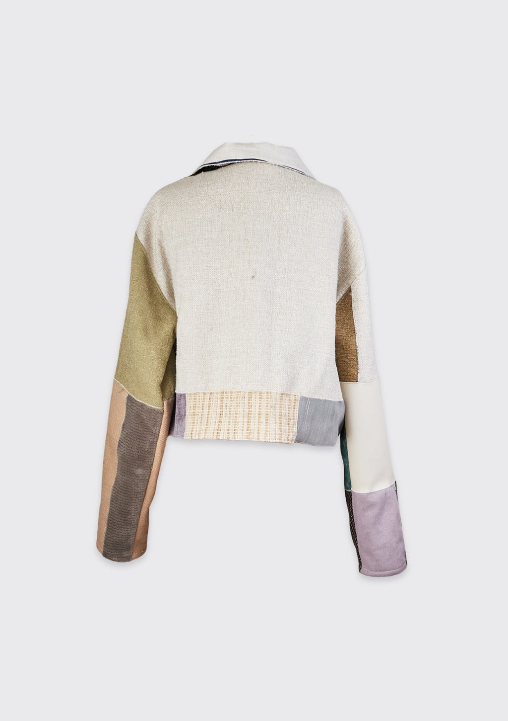 Color-blocked jacket with a mix of beige, green, brown, and purple upcycled from upholstery swatches on a white background