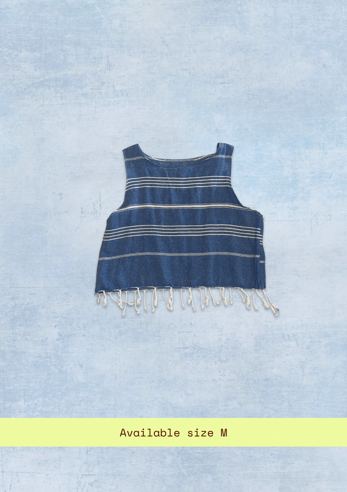 Blue cropped tank top with fringes upcycled from a turkish towel  on a light blue background