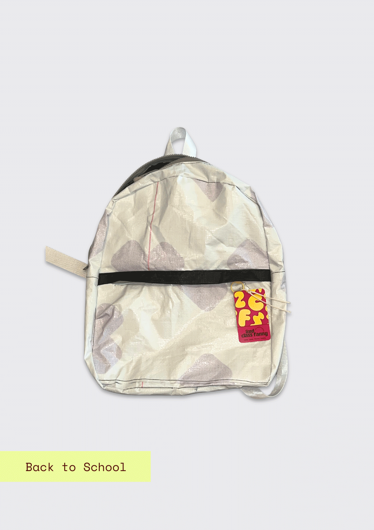 Backpack upcycled from a billboard vinyl  with a visible brand logo on a light gray background