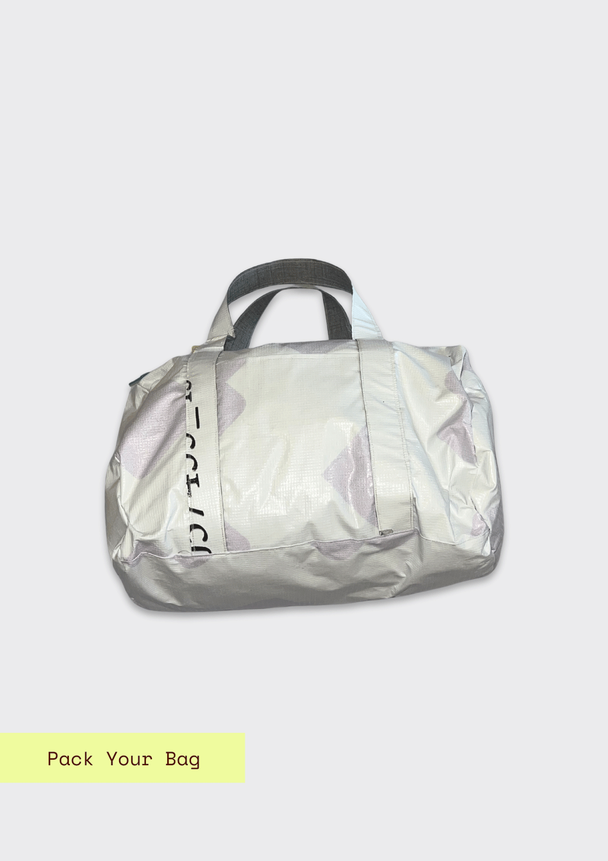 White duffle bag with gray handles on a light gray background upcycled from billboard vinyl