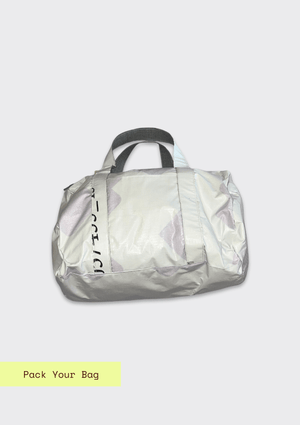 White duffle bag with gray handles on a light gray background upcycled from billboard vinyl