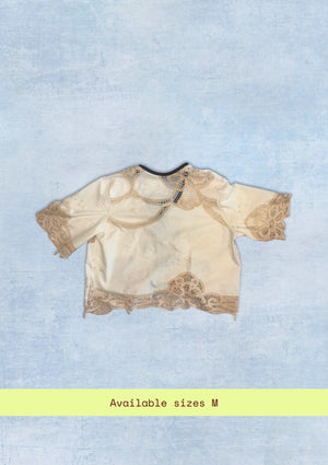 Beige lace top on a light blue background with 'Available sizes M' text.