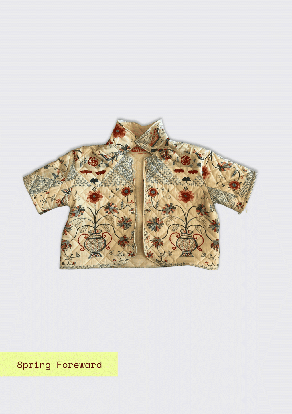 Floral embroidered jacket upcycled from a quilt on a light gray background with 'Spring Forward' text.