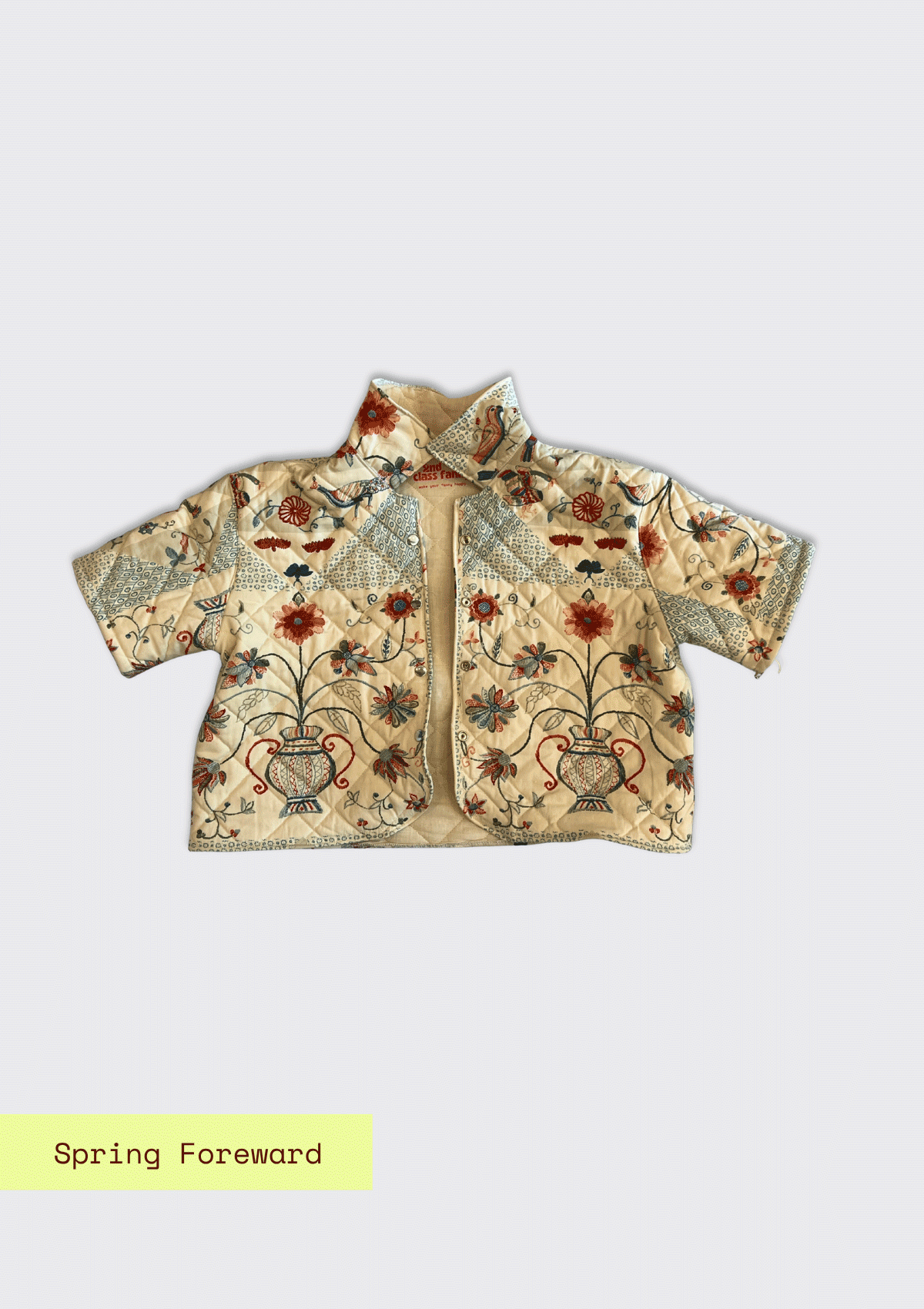 Floral embroidered jacket upcycled from a quilt on a light gray background with 'Spring Forward' text.