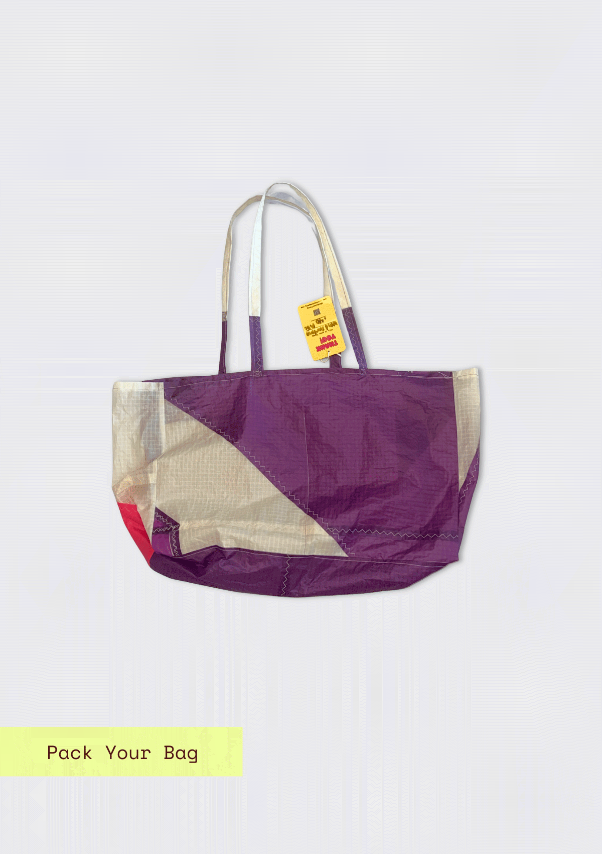 Purple and white tote bag upcycled from a windsurfing kite on a light gray background