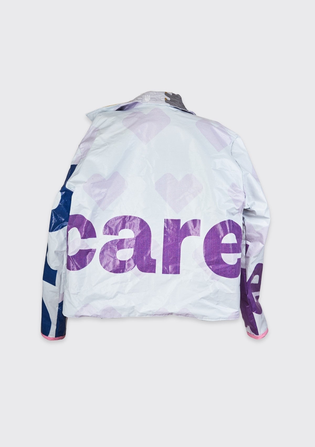 Backside of white coat ucpcyled from billboard with care written on a grey background