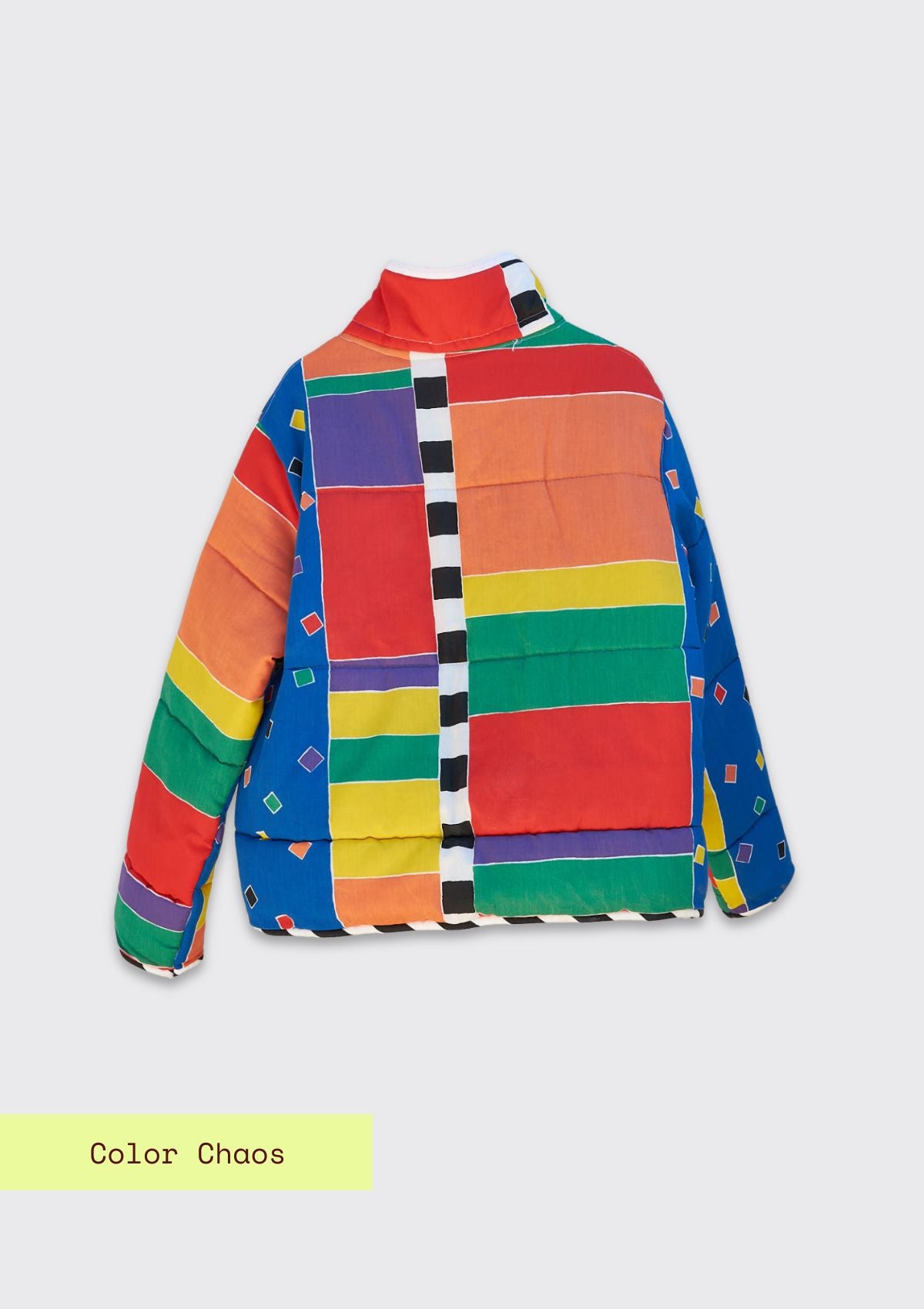 Colorful jacket with geometric pattern upcycled from a comforter on a light gray background