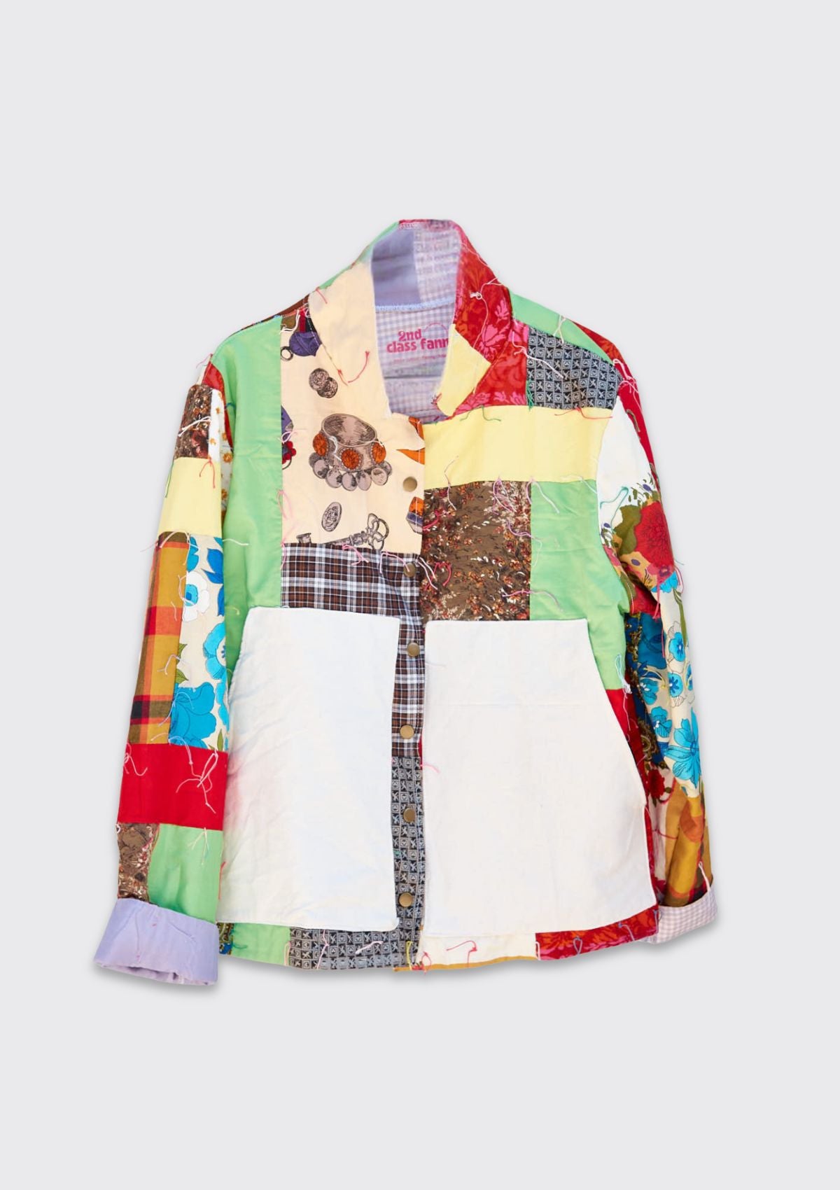 Colorful patchwork jacket upcycled from a quilt on a white background.