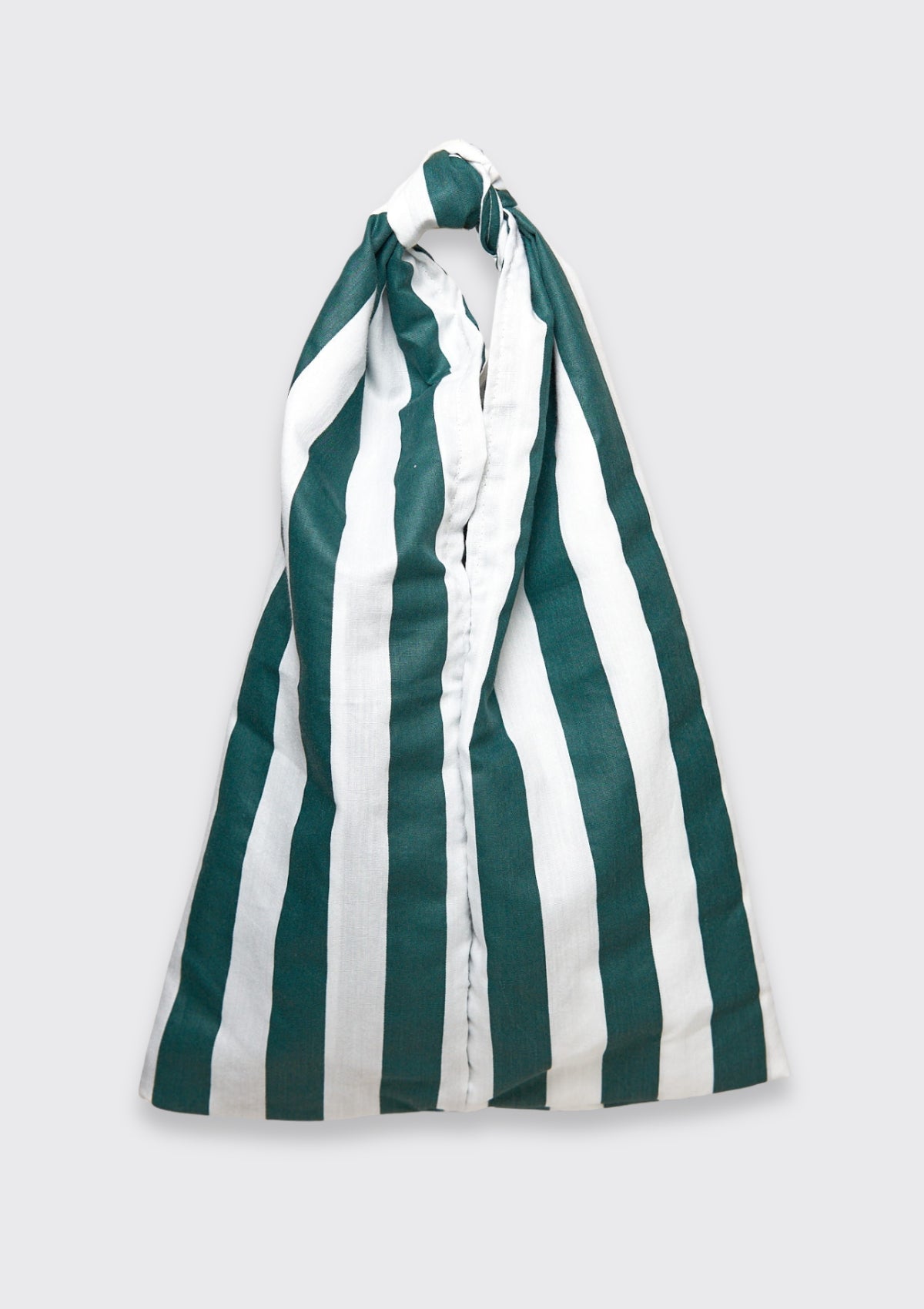 Green and white striped knot bag upcycled form designer deadstock fabric on a light gray background