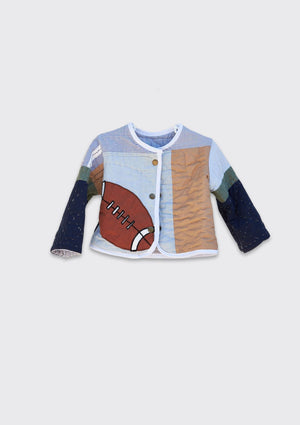 Children's jacket with football design made from upcycled quilt on a light gray background