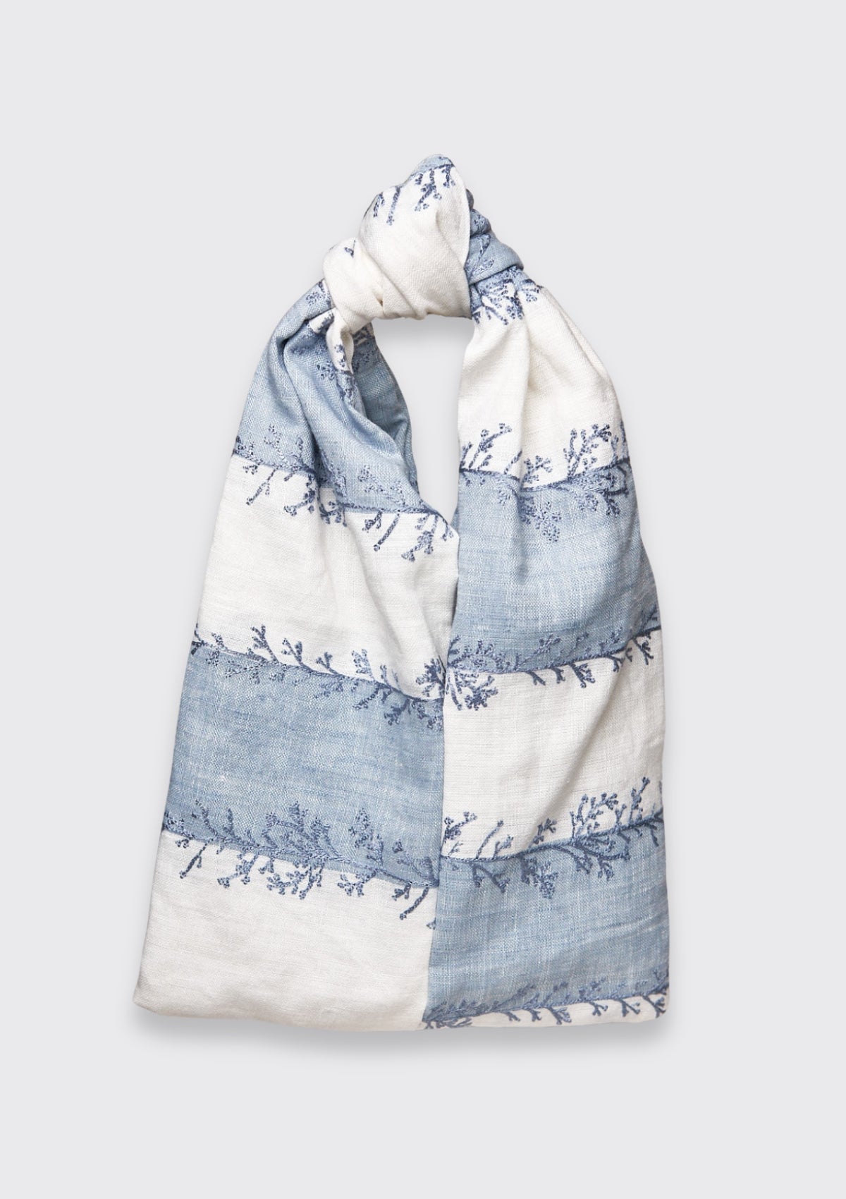 Blue and White coral patterned knot bag upcycled form designer deadstock fabric on a light gray background